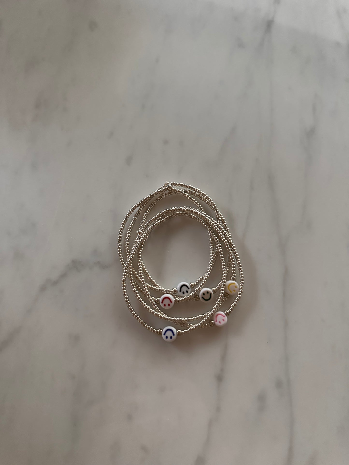 Handmade zilver smiley armbandje